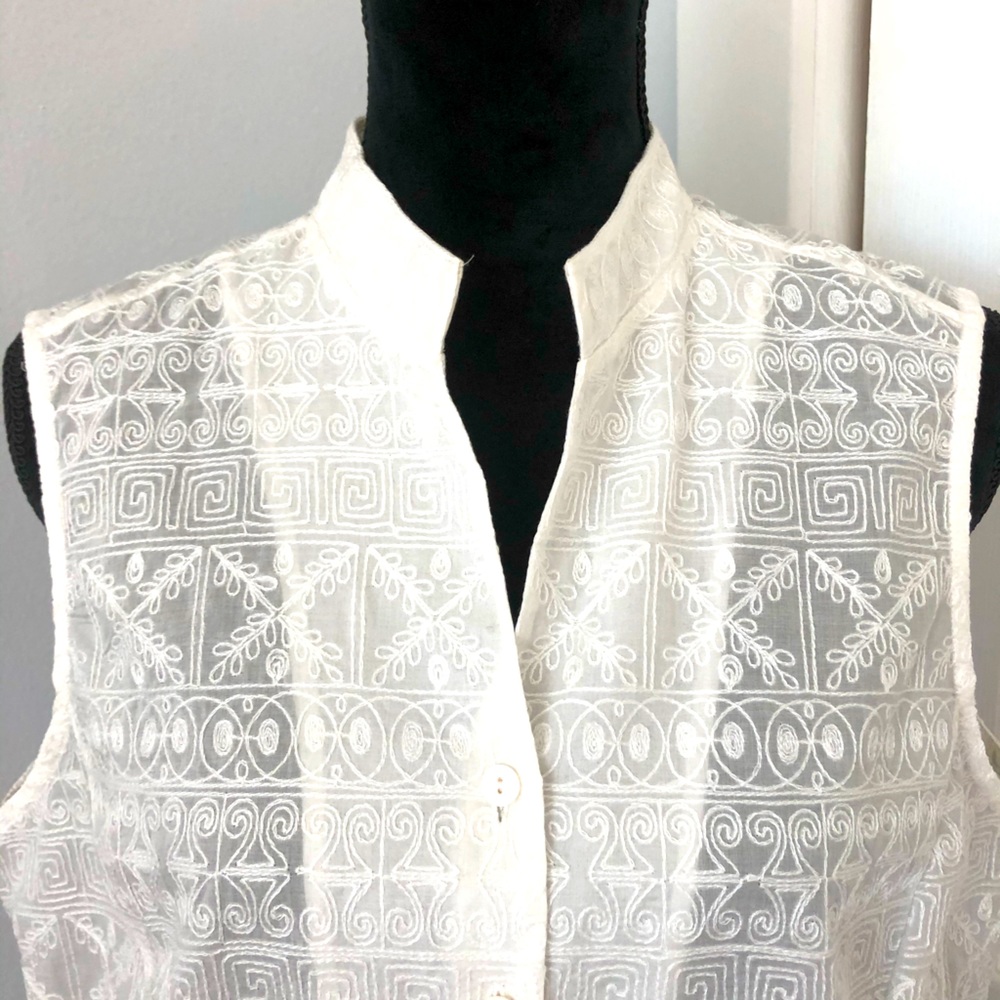 Sleeveless off white top